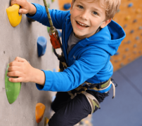 Boy wall climbing